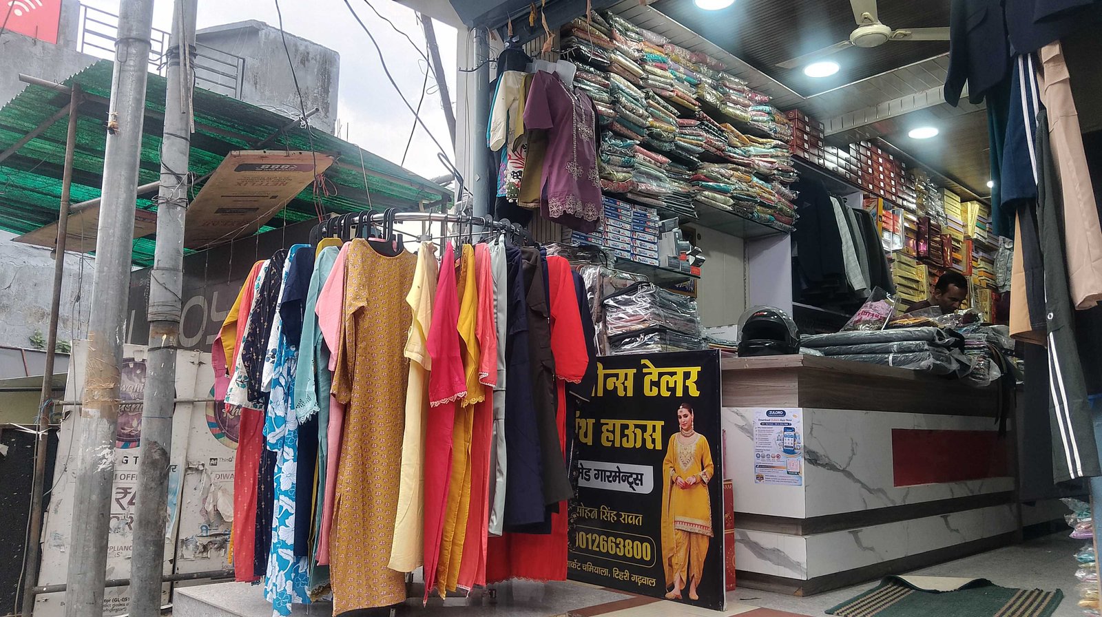 Dress rental display outside Fine Jeans Tailor & Cloth House